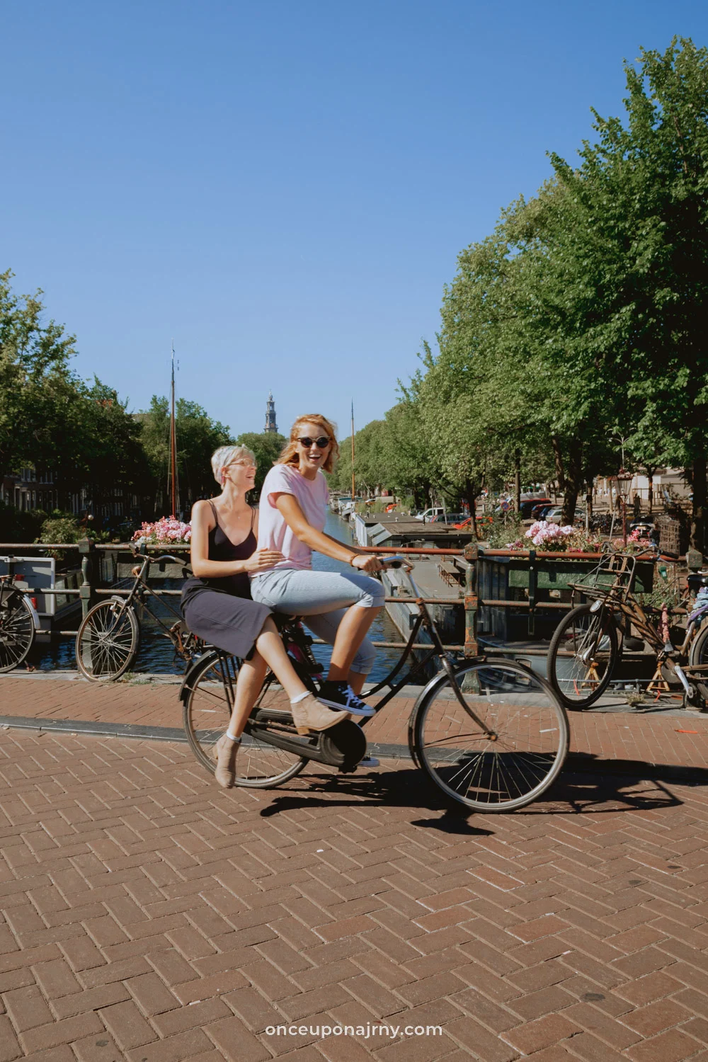 LGBT Amsterdam couple on bike