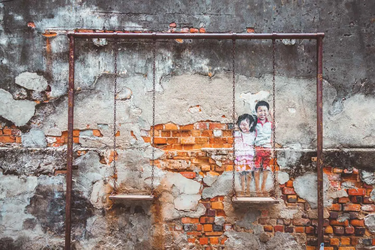 Brother and Sister on a swing by Louis Gan Yee Loong, Penang Street Art, Malaysia