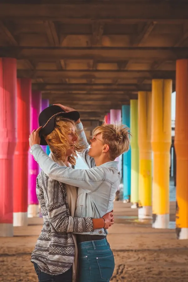 Lesbian couple at rainbow pier in the Netherlands