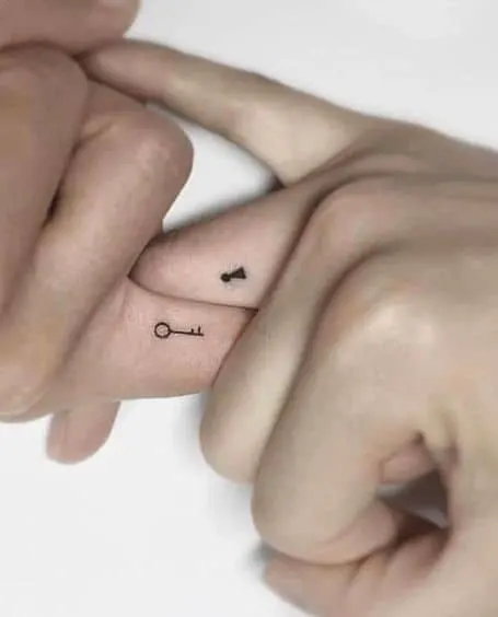 cute alien finger tattoo