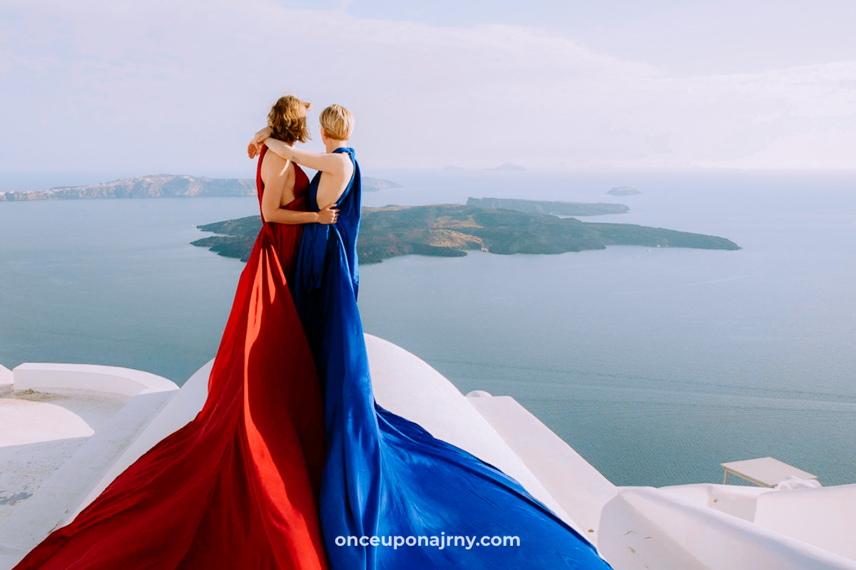 Lesbian couple Flying Dress Santorini Photoshoot Imerovigli Caldera rooftop view