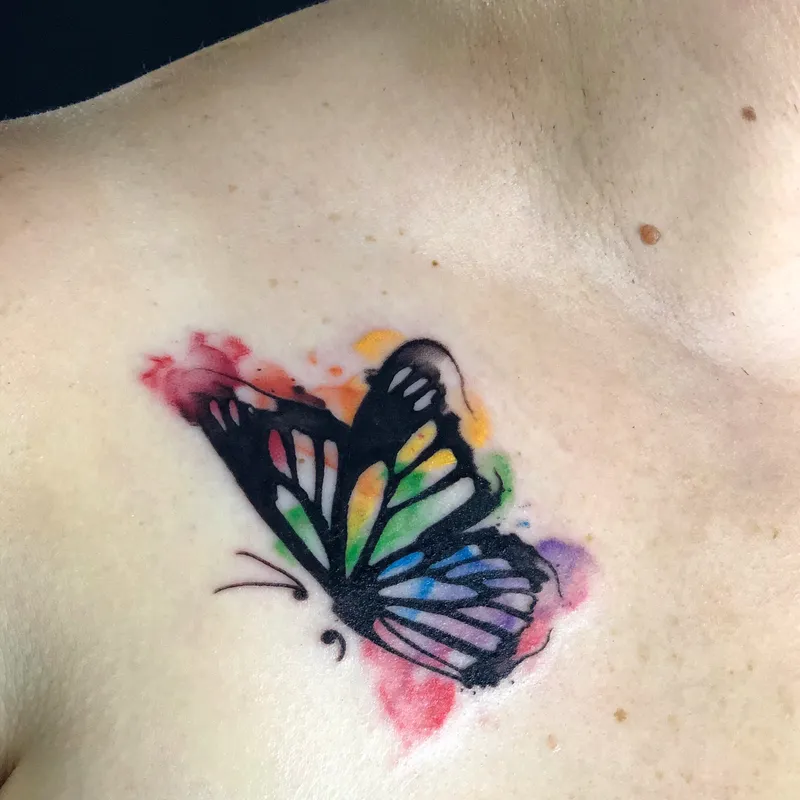 Joel Mejia Small rainbow butterfly tattoo