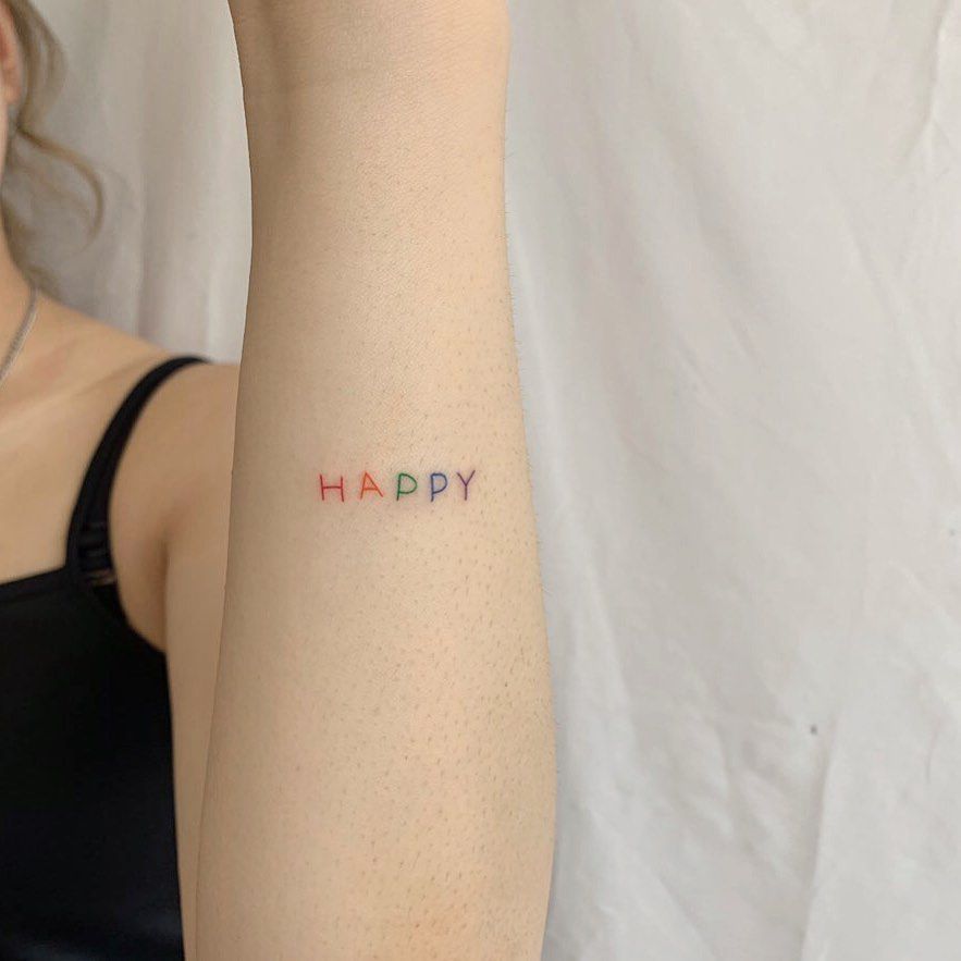 Rainbow Word Happy Tattoo by broccoli_tattooer