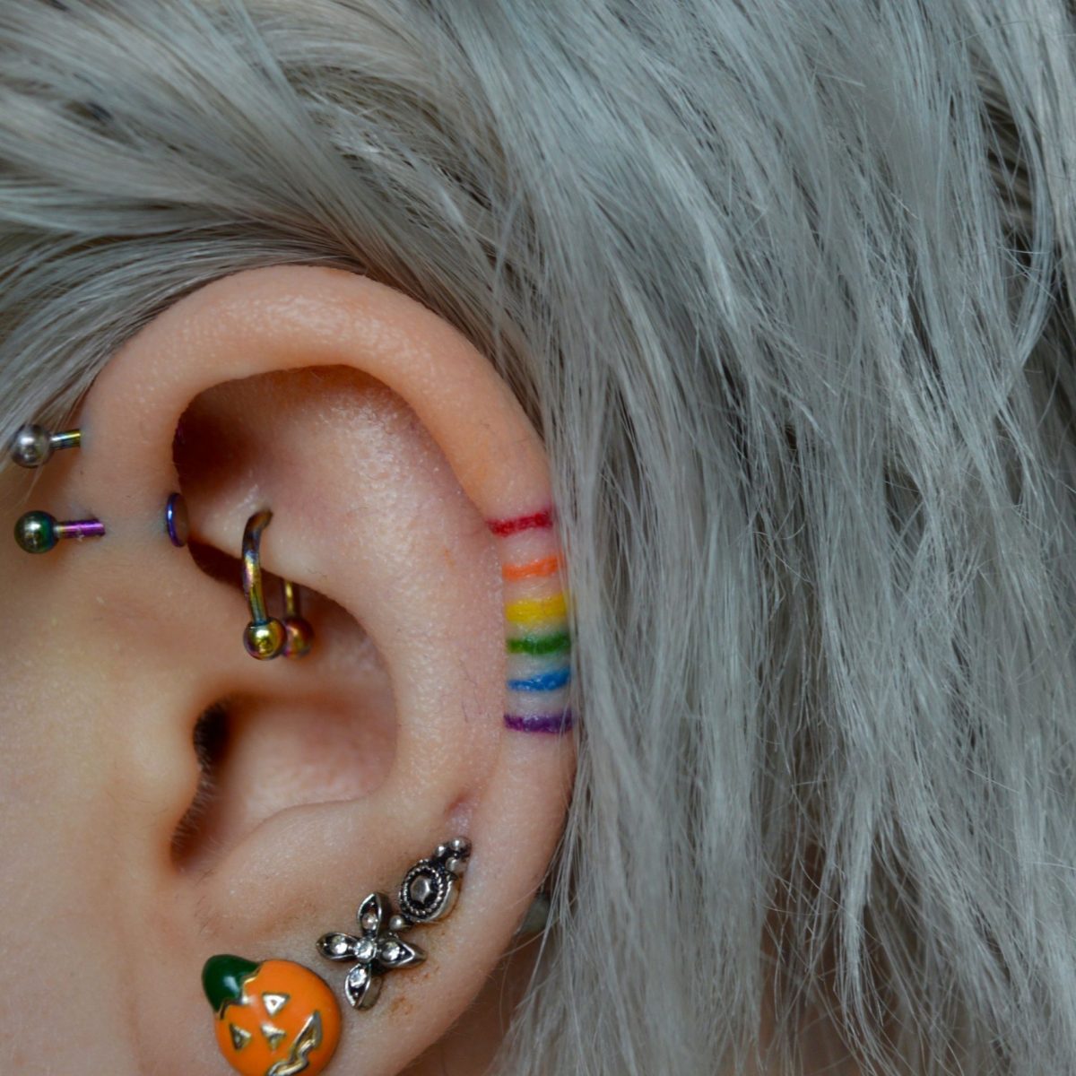 Rainbow ear tattoo by aaliyahdeaconx