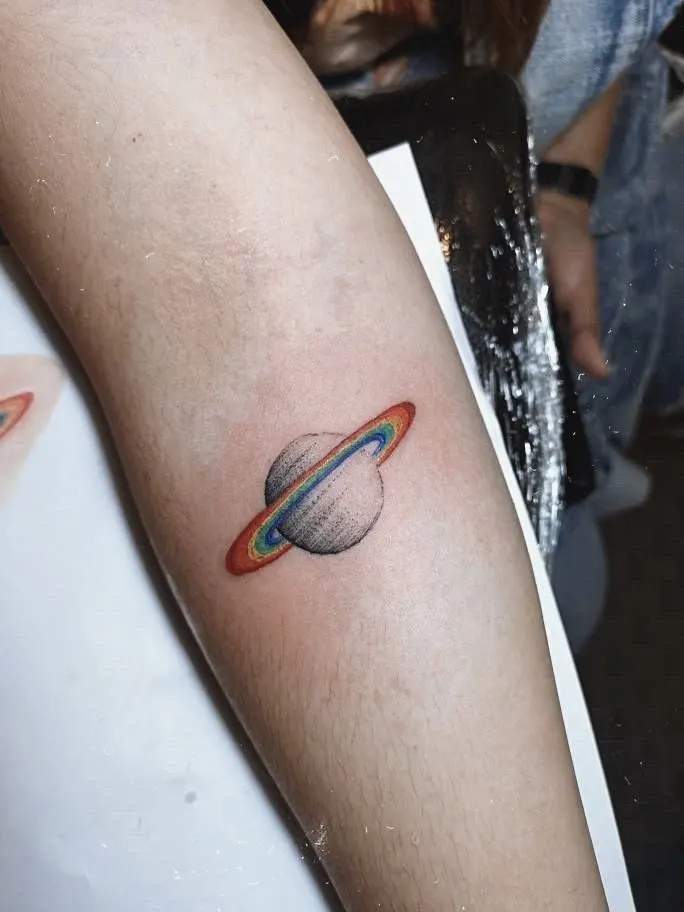 Saturn rainbow tattoo by shairvta