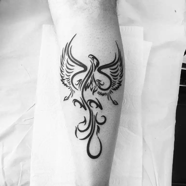 Tribal-Phoenix-Tattoo-On-Leg tattoostime