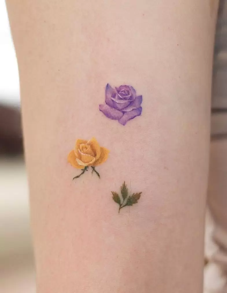 Purple yellow flower tattoo