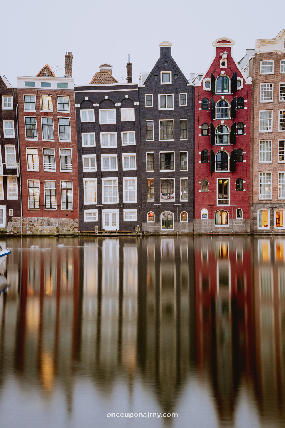 Damrak Amsterdam canal houses